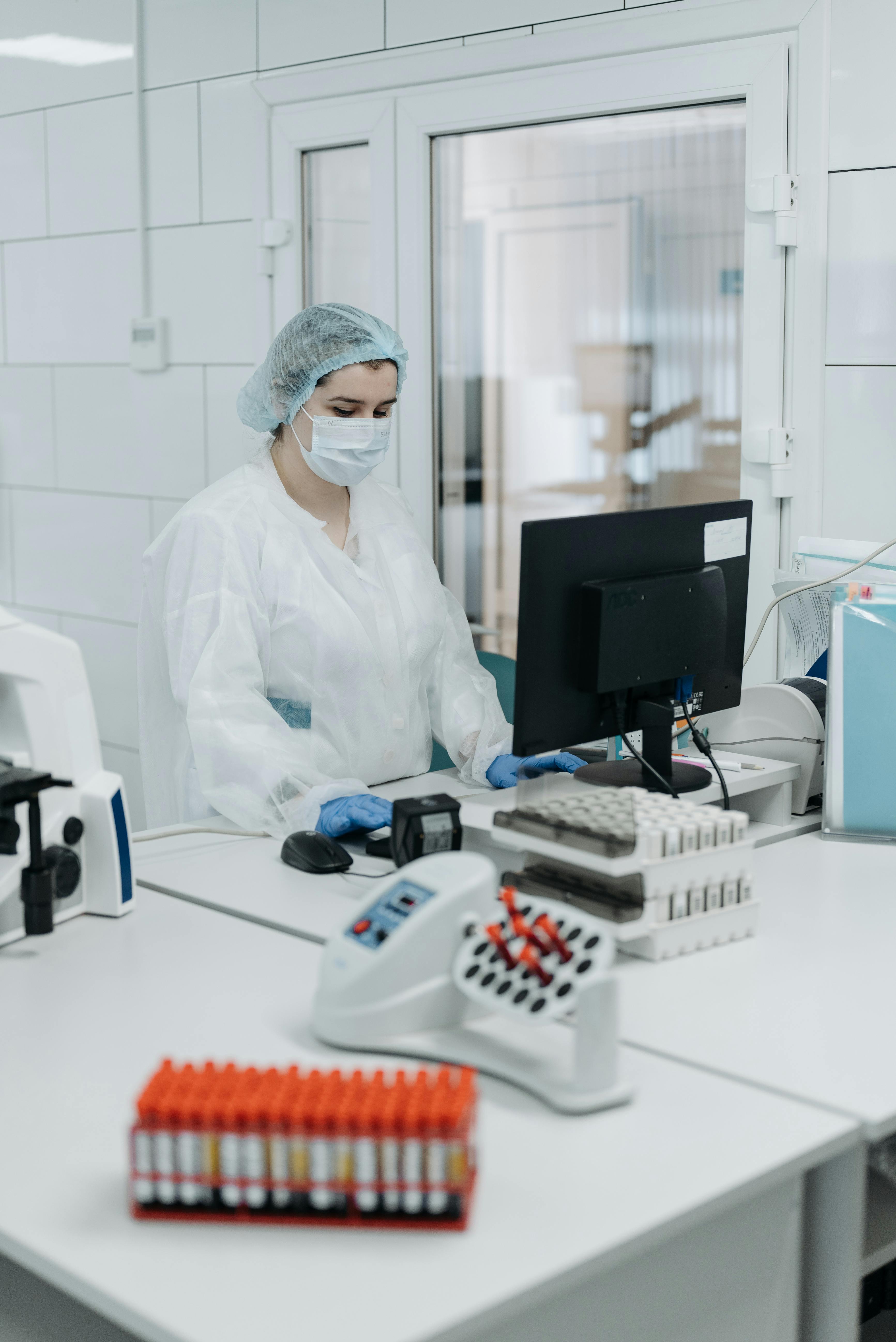 Lab technician at controlled workstation